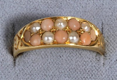 Lot 655 - A Coral and Seed Pearl Ring, two bands of alternating coral and seed pearls, to a tapering...