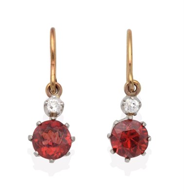 Lot 661 - A Pair of Hessonite Garnet and Diamond Earrings, an old cut diamond in a claw setting suspends...