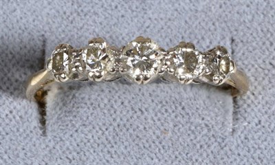 Lot 663 - An 18 Carat Gold Diamond Ring, five graduated round brilliant cut diamonds in double claw settings