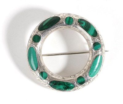 Lot 665 - A Scottish Malachite Plaid Brooch, a circular frame with foliate engraved decoration and inlaid...