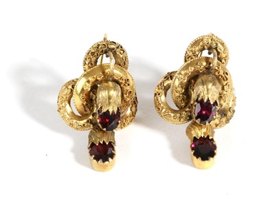 Lot 667 - A Pair of Victorian Garnet Earrings, an oval cut garnet in a collet setting within a flower...