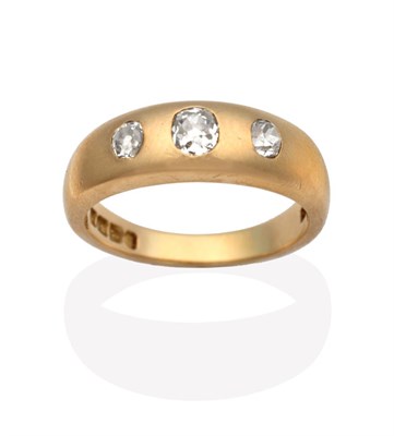 Lot 677 - An 18 Carat Gold Diamond Three Stone Ring, graduated old cut diamonds inset to a tapering...