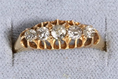 Lot 689 - An 18 Carat Gold Diamond Ring, five graduated old cut diamonds in a carved setting, total estimated