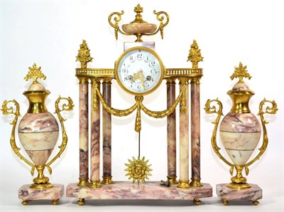 Lot 1220 - A Gilt Metal and Marble Portico Striking Mantel Clock Garniture, early 20th century, portico...