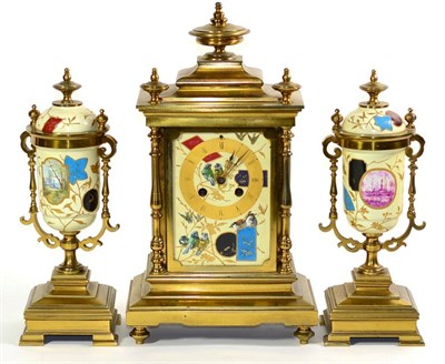 Lot 1232 - An Aesthetic Brass Ceramic Mounted Striking Mantel Clock Garniture, circa 1890, front and side...