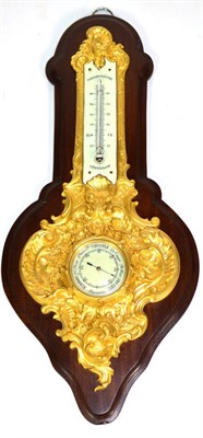 Lot 1235 - An Ormolu Aneroid Barometer, circa 1900, scroll and floral decorated case signed to the edge...