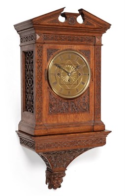 Lot 1257 - A Carved Oak Chiming Bracket Clock, circa 1880, broken arch pediment, blind fret borders, side...