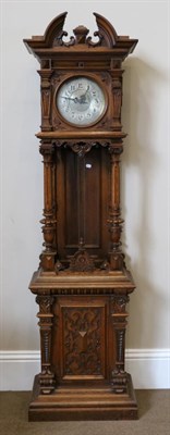 Lot 1286 - A German Carved Oak Striking Longcase Clock, circa 1880, broken arch form pediment with three...