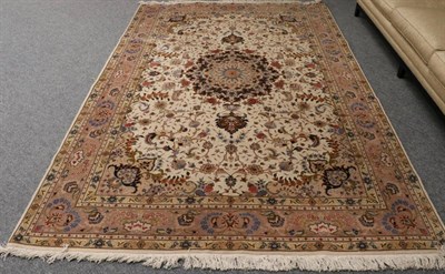 Lot 1290 - Tabriz Carpet Iranian Azerbaijan, modern The cream field of vines around a central medallion framed