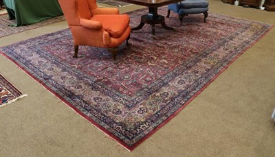 Lot 1291 - Indian Carpet, circa 1910 The raspberry field with an allover one way design of serrated...