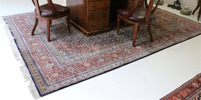 Lot 1299 - Indian Carpet, modern The indigo Herati field centred by a dove grey medallion framed by terracotta