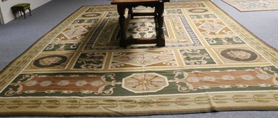 Lot 1301 - Portuguese Machine Made Carpet, late 19th/early 20th century The polychrome compartmentalised field