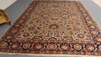 Lot 1302 - Tabriz Carpet Iranian Azerbaijan, circa 1940 The ivory field of large flowerheads and vines...