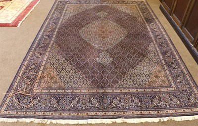 Lot 1304 - Good Tabriz Carpet Iranian Azerbaijan, circa 1970 The floral lattice field centred by a pole...