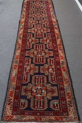 Lot 1307 - Tafrish Runner West Iran, circa 1950 The field with a column of cruciform medallions enclosed...