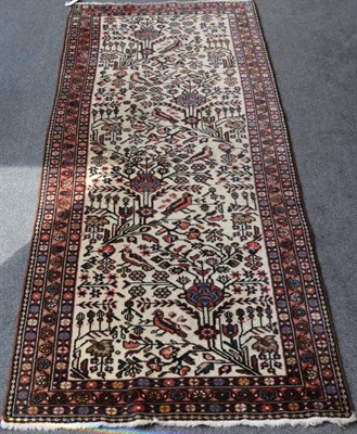 Lot 1308 - Narrow Malayir Runner West Iran, modern The cream field of birders and angular plants enclosed...