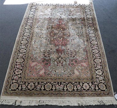 Lot 1313 - Kashmir Silk Piled Rug North West India, circa 1970 The ivory field with an anchor medallion...