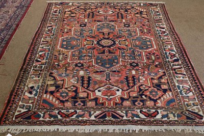 Lot 1333 - Bakhtiari Rug West Iran, circa 1930 The coral pink field of stylised plants around a flowerhead...