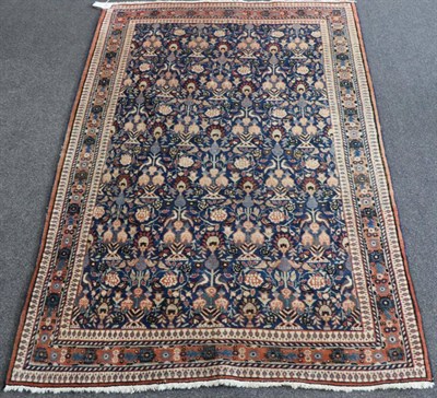 Lot 1335 - Central Iranian Rug, Veramin, circa 1960 The mid indigo field with a one way design of birds...