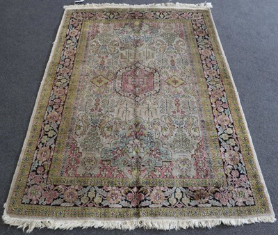 Lot 1336 - Kashmir Silk Rug North West India, circa 1930 The ivory field of stylised plants around a medallion