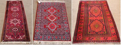 Lot 1342 - Very Narrow Heriz Runner Iranian Azerbaijan, circa 1980 The claret field with a row of...