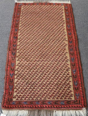 Lot 1350 - Unusual Balouch Rug West Afghanistan, circa 1920 The ivory field with diagonal columns of geometric