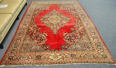 Lot 1351 - Saroukh Carpet West Iran The abrashed strawberry field with central medallion framed by...