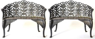 Lot 1367 - A Pair of Good Quality Cast Iron Fern and Berry Garden Benches, 20th century, of curved form...