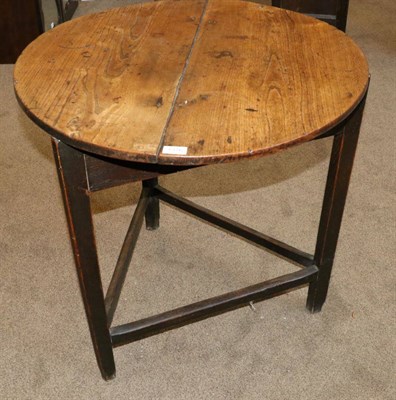 Lot 1376 - An Early 19th Century Elm and Oak Circular Cricket Table, the two piece top raised on...