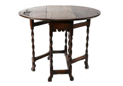 Lot 1387 - An Oak Dropleaf Table, late 17th/early 18th century, with two rounded drop leaves to form an...