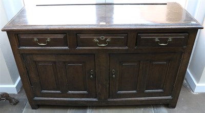 Lot 1389 - An Early 18th Century Joined Oak Enclosed Dresser, with three frieze drawers above two fielded...