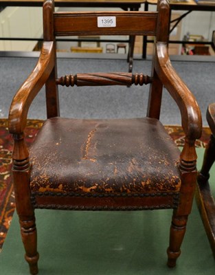 Lot 1395 - An Early Victorian Child's Armchair, upholstered in close-nailed brown leather, with ring...