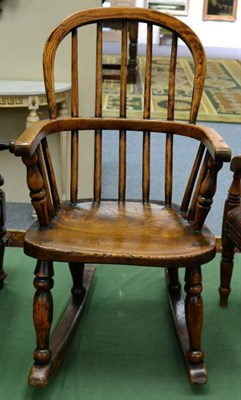 Lot 1397 - A 19th Century Ash and Elm Child's Windsor Rocking Chair, with double spindle back support and...