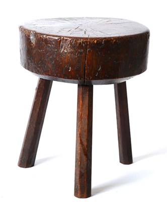 Lot 1407 - A 19th Century Primitive Oak Stool or Chopping Block, of trunk form raised on three chamfered legs