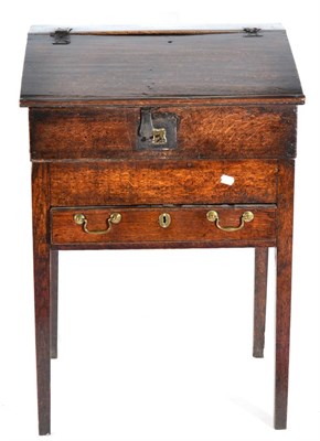 Lot 1409 - A George III Oak Estate Clerk's Desk, late 18th/early 19th century, with hinged lid enclosing...