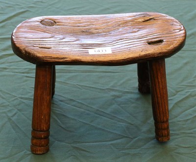 Lot 1411 - A 19th Century Elm Stool, of oval form, raised on four turned legs, 31cm by 18cm by 19cm