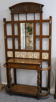 Lot 1415 - A Victorian Oak and Tiled-Back Hallstand, late 19th century, with moulded and fluted pediment...