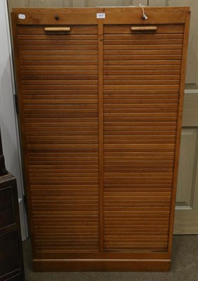 Lot 1417 - A 1920/30s Oak Double Fronted Tambour Office Cabinet, the interior with an arrangement of...