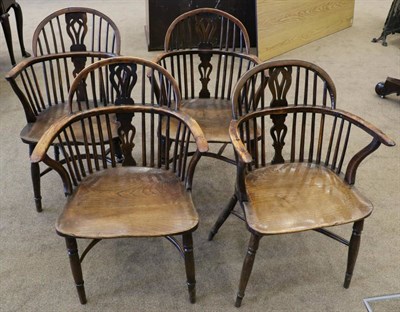 Lot 1418 - A Matched Set of Four Mid 19th Century Yew and Elm Windsor Armchairs, with double spindle back...