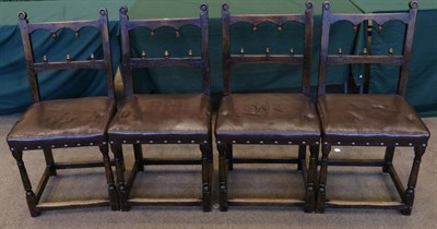 Lot 1422 - A Set of Four 17th Century Style Dining Chairs, upholstered in brown leather, with arched top rails