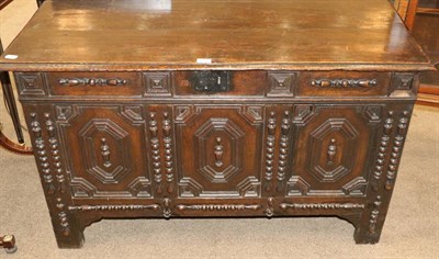 Lot 1428 - A 17th Century Joined Oak Coffer, with hinged lid above three geometric moulded panels with applied