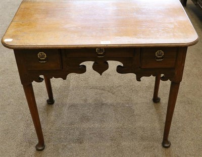 Lot 1429 - A George III Oak Lowboy or Dressing Table, late 18th century, with moulded top above three...