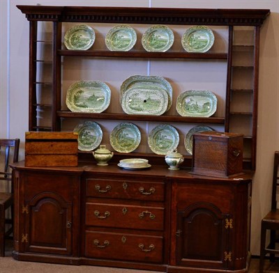 Lot 1430 - A George III Style Oak Enclosed Dresser and Rack, the rack of inverted breakfront form with...