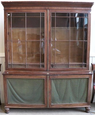 Lot 1440 - A Mahogany Bookcase, 2nd quarter 19th century, with glazed doors enclosing adjustable shelves,...