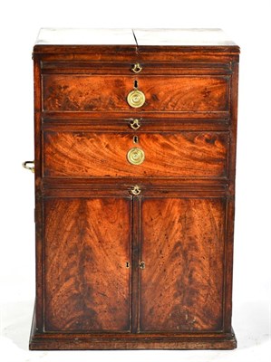 Lot 1441 - A George III Mahogany Campaign Travelling Chest, circa 1800, with folding leaves above pull-out...