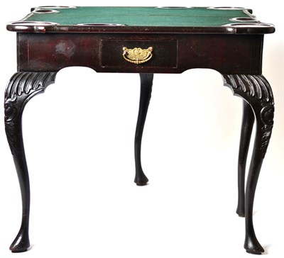 Lot 1443 - A Victorian Ebonised Foldover Games Table, late 19th century, in George II style, with hinged...