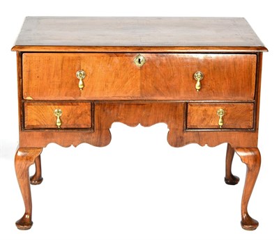 Lot 1444 - An 18th Century Walnut, Featherbanded and Crossbanded Kneehole Desk or Dressing Table, the top...