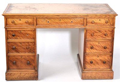 Lot 1459 - A Victorian Satinwood Double Pedestal Desk, circa 1870, with three frieze drawers, one pedestal...