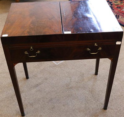 Lot 1463 - A George III Mahogany and Ebony Strung Dressing Table, circa 1800, with hinged lid above a pull-out