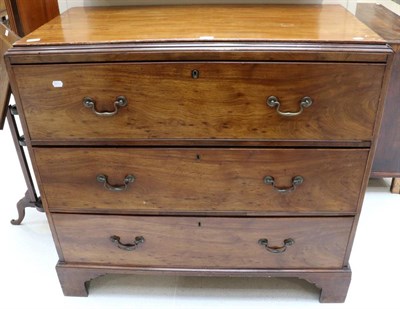 Lot 1466 - A George III Mahogany Secretaire Chest, circa 1800, with later pine top above a deep drawer...